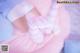 A close up of a person wearing pink and white striped socks.
